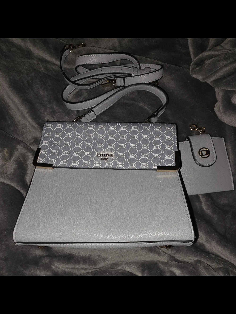 Dune London two-tone flapover crossbody bag and matching wallet set.